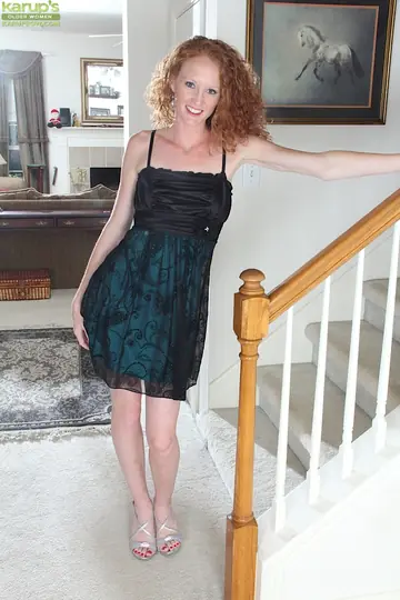 Curly-Haired Mature Woman Lifts Her Skirt and Spreads Her Pussy