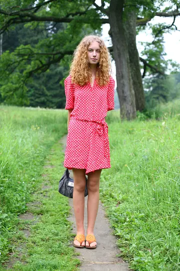 Curly-Haired Woman Spreads Her Pussy Outdoors