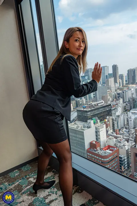 Rei Hoshino: Busty European Brunette in Uniform and Heels Spreads by the Window – photo 3 of 20