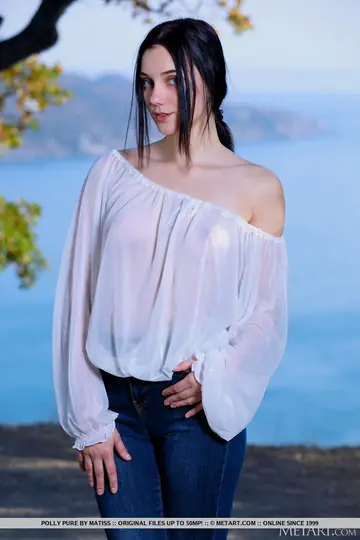 Brunette Strips Out of Her Jeans on a Seaside Cliff