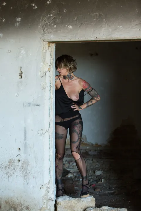 Stacy Cloud: Short-Haired Busty Woman Poses in Pantyhose Showing Her Tattoo – photo 7 of 21