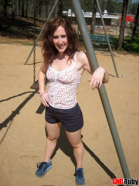 Redhead PAWG Crosses Her Legs on a Swing in a Public Park – photo 5 of 12