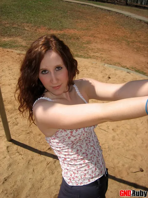 Redhead PAWG Crosses Her Legs on a Swing in a Public Park – photo 8 of 12