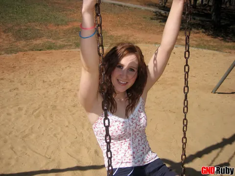 Redhead PAWG Crosses Her Legs on a Swing in a Public Park – photo 1 of 12