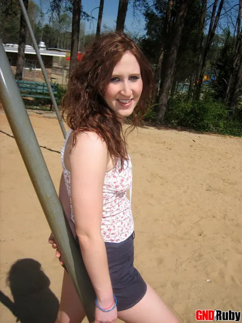 Redhead PAWG Crosses Her Legs on a Swing in a Public Park – photo 6 of 12