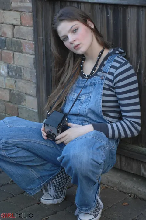 Woman Strips Out of Her Jeans Nude by a Window Outdoors – photo 1 of 12