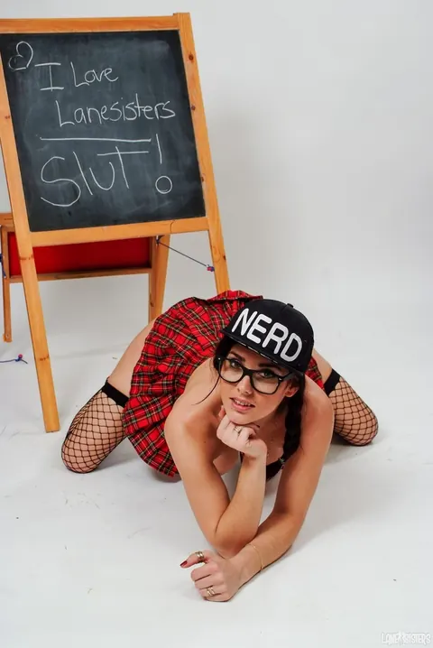 Roxy Lane: Redhead in Stockings and Glasses Strips by the Blackboard – photo 20 of 21