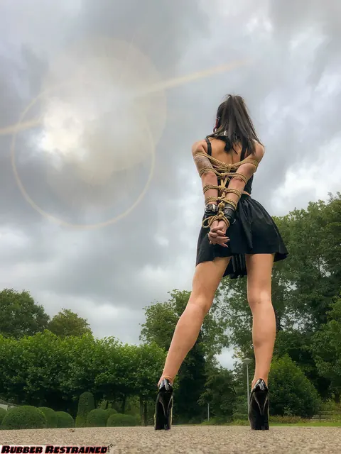 Asian Woman Bound in a Skirt and Heels in Public Park – photo 11 of 16