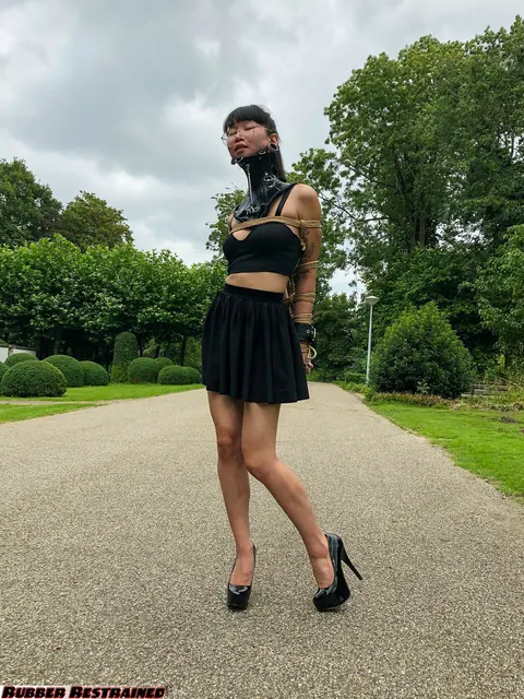 Asian Woman Bound in a Skirt and Heels in Public Park – photo 14 of 16