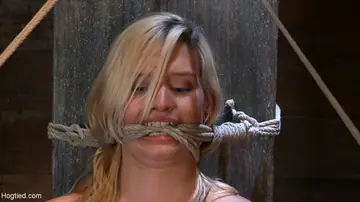 Tall Blonde Bound in Hogtie Spreads and Uses a Dildo