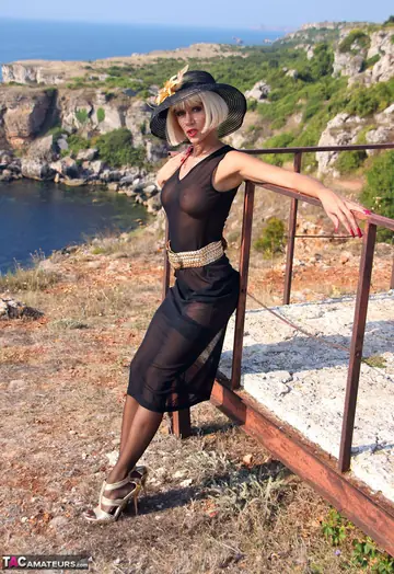 Slim Blonde MILF Lifts Her Skirt Outdoors in Stockings