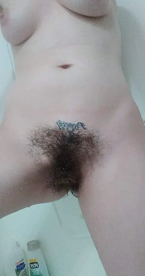 Busty Brunette Reveals Her Hairy Pussy in the Bathroom – photo 7 of 14