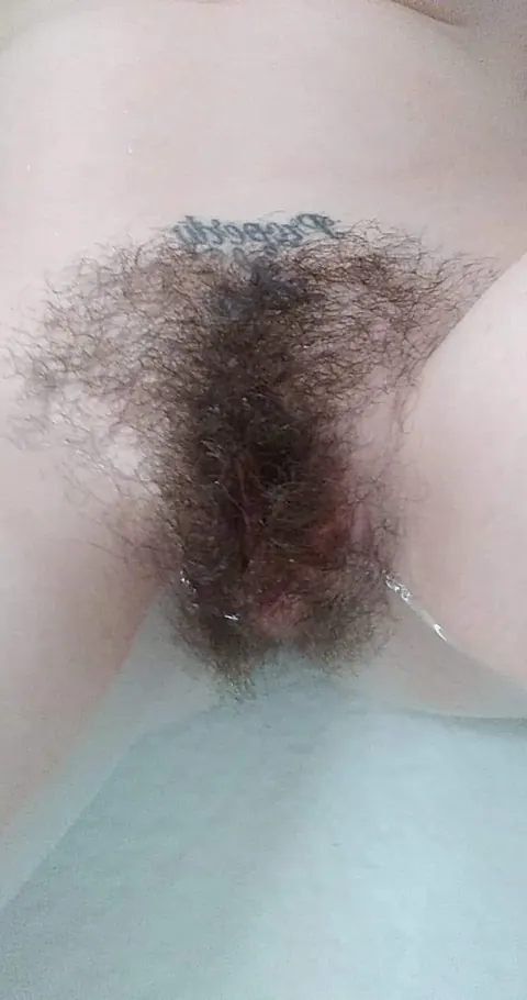 Busty Brunette Reveals Her Hairy Pussy in the Bathroom – photo 4 of 14
