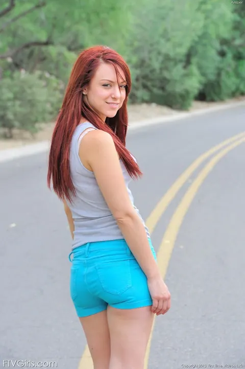 Redhead Strips Out of Her Shorts and Poses in Lingerie Outdoors – photo 2 of 16