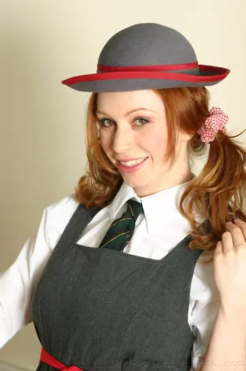 Redhead in Pigtails Strips Out of Her Uniform and Pantyhose