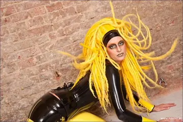Dominant Woman in Latex and High Heels Undresses