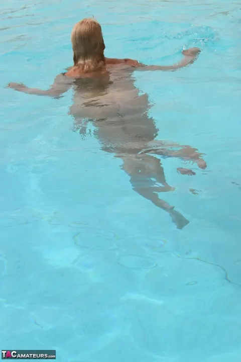 Mature Curvy Blonde Reveals Her Natural Tits by the Pool – photo 11 of 16