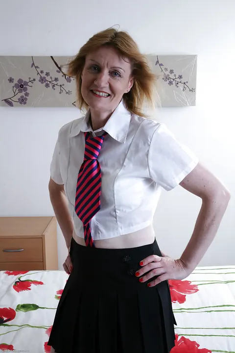 Clare Cream: Thick Redhead MILF Strips Out of Her Uniform and Spreads Her Shaved Pussy – photo 1 of 16