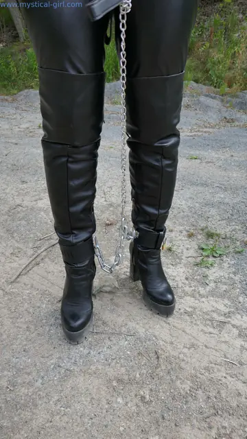PAWG Restrained in Leather and Chains Outdoors