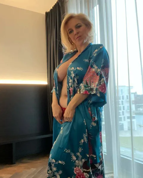 Curvy Blonde MILF Strips to Lingerie and Shows Her Big Tits – photo 11 of 20