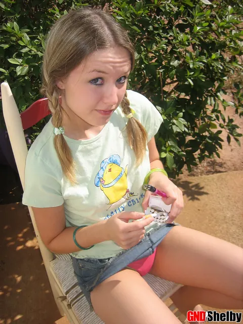 Woman in Pigtails Pulls Panties Aside Outdoors – photo 2 of 12