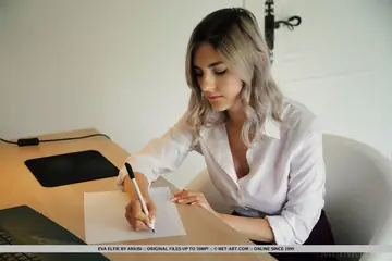 European Blonde Spreads Her Shaved Pussy on the Table