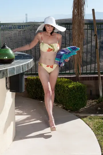 Busty Redhead MILF Strips Out of Her Bikini by the Pool
