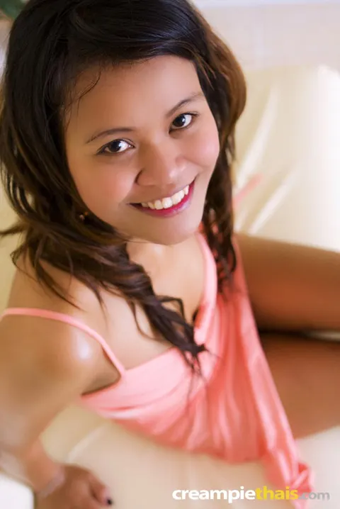 Thai Brunette Pulls Panties Aside to Show Her Shaved Pussy – photo 5 of 21