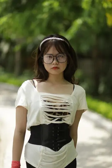 Busty Thick Asian Babe Poses in Glasses Outdoors