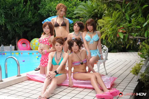 Asian Redhead and Japanese Woman Kiss in Bikinis Poolside – photo 14 of 15