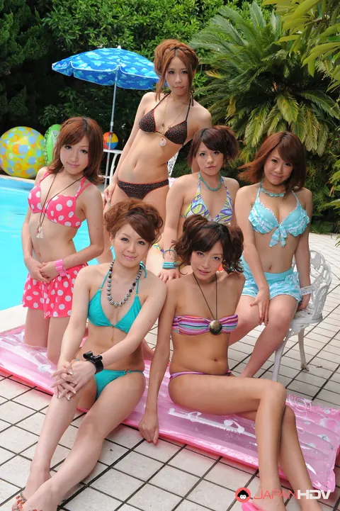 Asian Redhead and Japanese Woman Kiss in Bikinis Poolside – photo 4 of 15