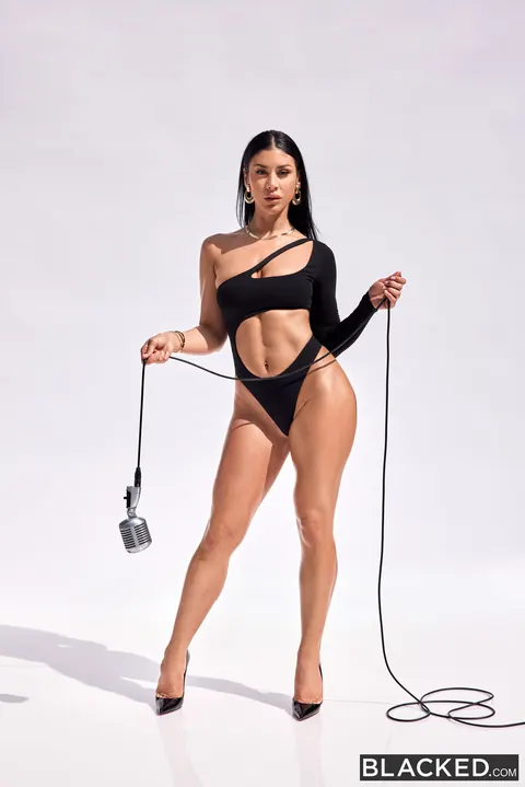 Busty Brunette Undresses for Interracial Sex with a Black Man – photo 7 of 20