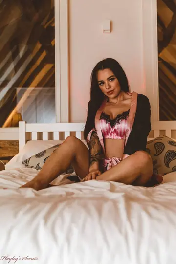 Tattooed Brunette Strips Out of Her Lingerie and Shorts on the Bed