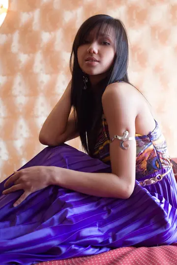 Woman in a Skirt Pulls Panties Aside and Spreads Her Legs Wide