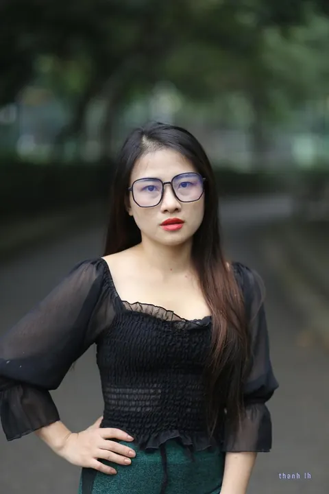 Asian Brunette with Big Tits Poses in a Top and Glasses Outdoors – photo 12 of 21