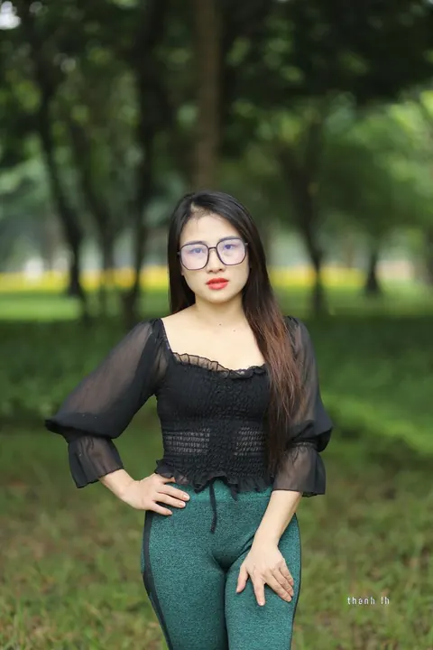 Asian Brunette with Big Tits Poses in a Top and Glasses Outdoors – photo 19 of 21