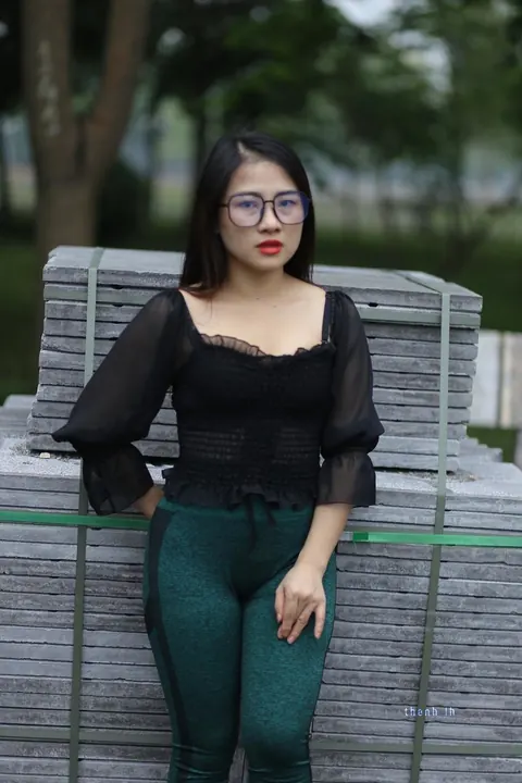 Asian Brunette with Big Tits Poses in a Top and Glasses Outdoors – photo 4 of 21