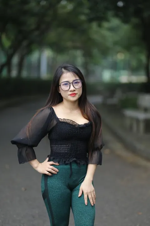 Asian Brunette with Big Tits Poses in a Top and Glasses Outdoors – photo 14 of 21