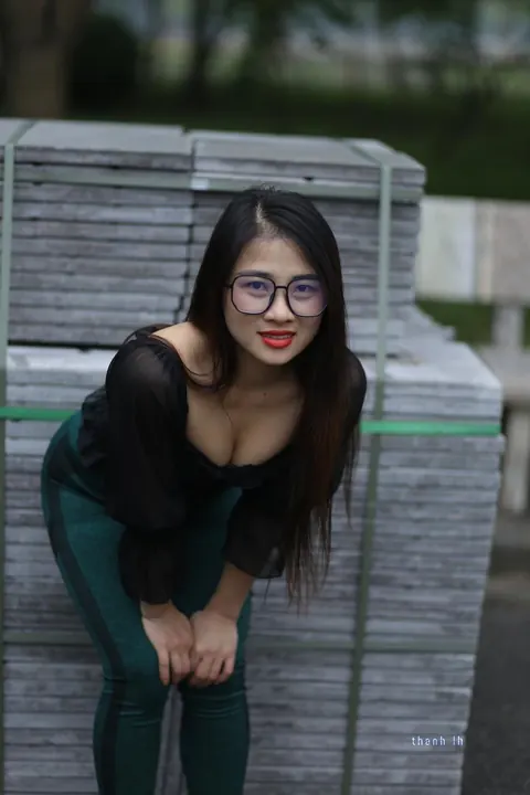 Asian Brunette with Big Tits Poses in a Top and Glasses Outdoors – photo 1 of 21