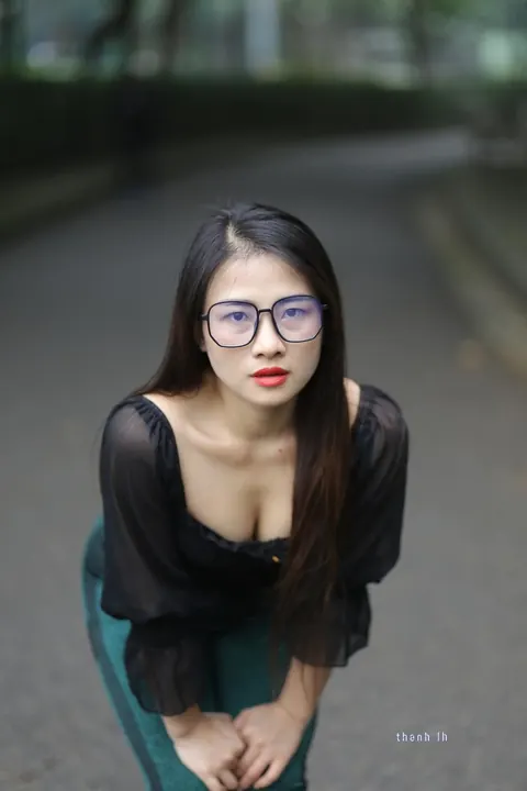 Asian Brunette with Big Tits Poses in a Top and Glasses Outdoors – photo 11 of 21