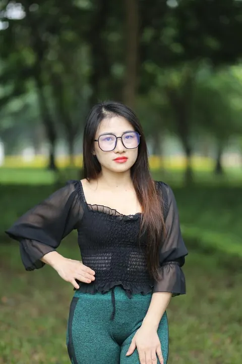 Asian Brunette with Big Tits Poses in a Top and Glasses Outdoors – photo 16 of 21