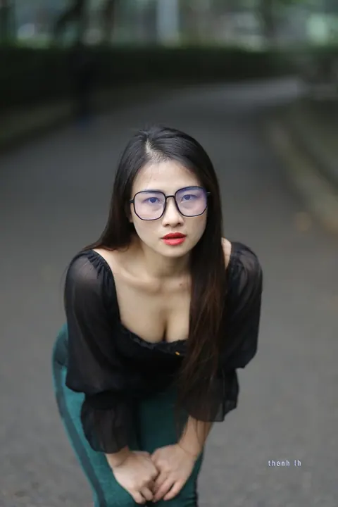 Asian Brunette with Big Tits Poses in a Top and Glasses Outdoors – photo 10 of 21