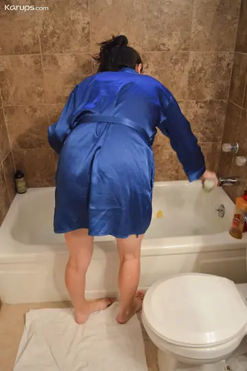 Brunette MILF with Big Tits Undresses and Spreads in the Bathroom