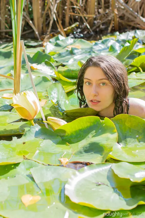Slim Brunette Shows Hairy Armpits Nude by the Pond – photo 16 of 21