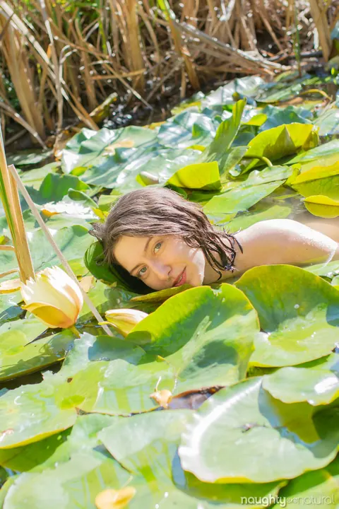 Slim Brunette Shows Hairy Armpits Nude by the Pond – photo 17 of 21