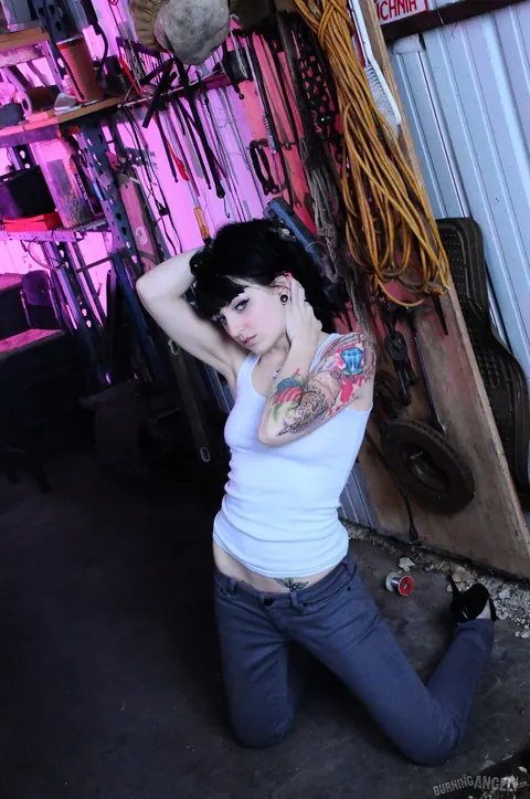 Draven Star: Short-Haired Brunette with Piercings Spreads Her Ass in the Garage Striptease – photo 2 of 17