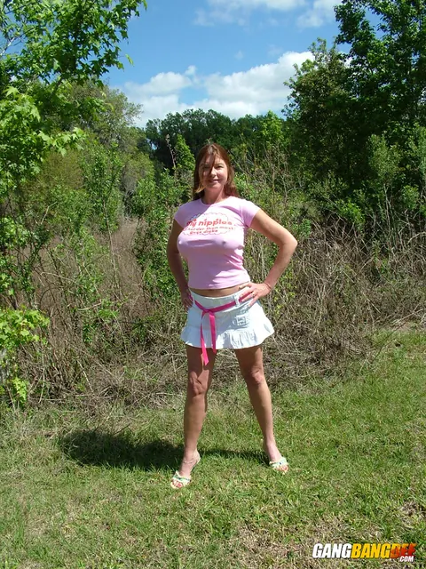 Dee Delmar: Busty Redhead MILF Poses Naked Outdoors – photo 3 of 15