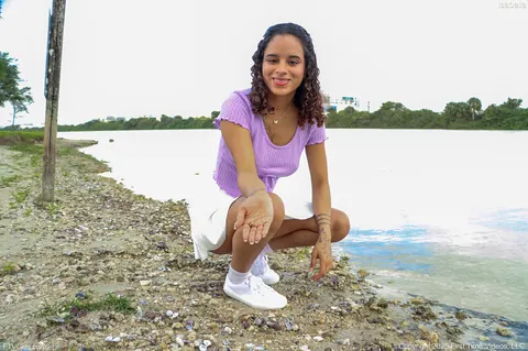 Latina in a Skirt and Sneakers Shows Her Enhanced Tits Outdoors – photo 7 of 15