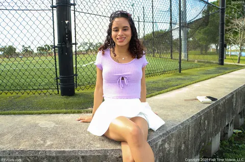 Latina in a Skirt and Sneakers Shows Her Enhanced Tits Outdoors – photo 1 of 15