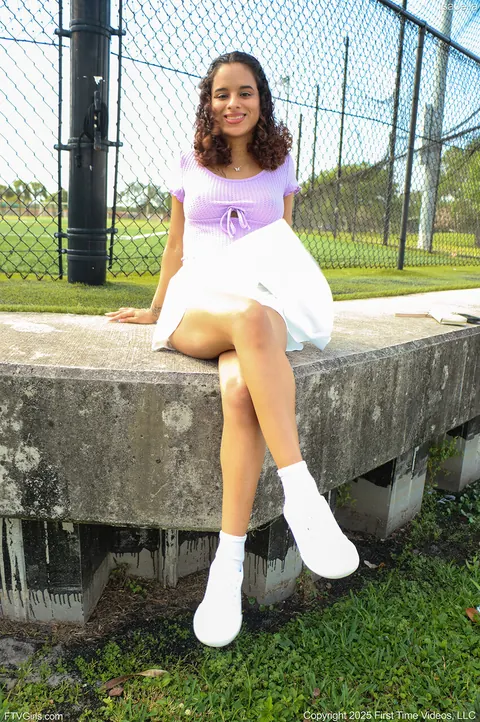 Latina in a Skirt and Sneakers Shows Her Enhanced Tits Outdoors – photo 3 of 15